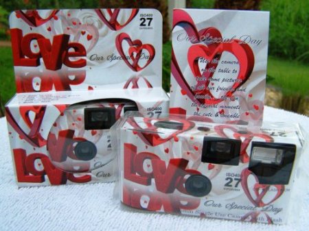 A popular wedding favor gift is a disposable camera with the name of the